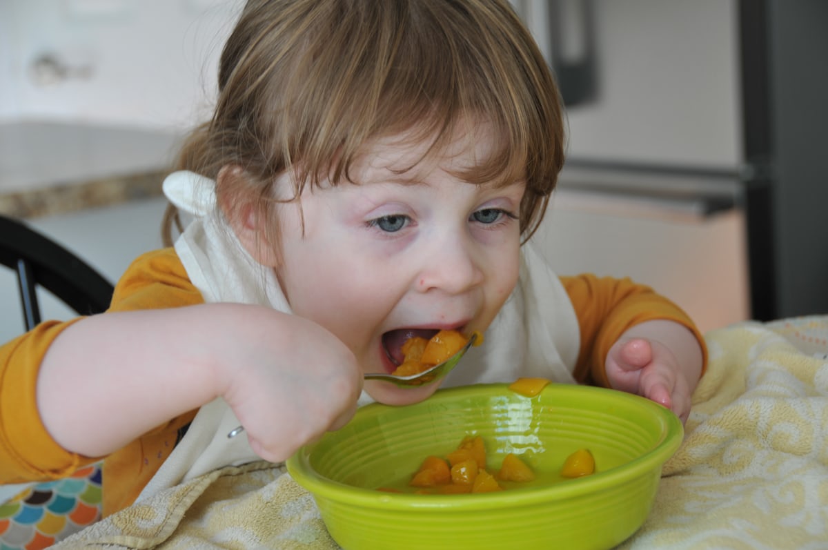 Child enjoying a peaceful healthy meal